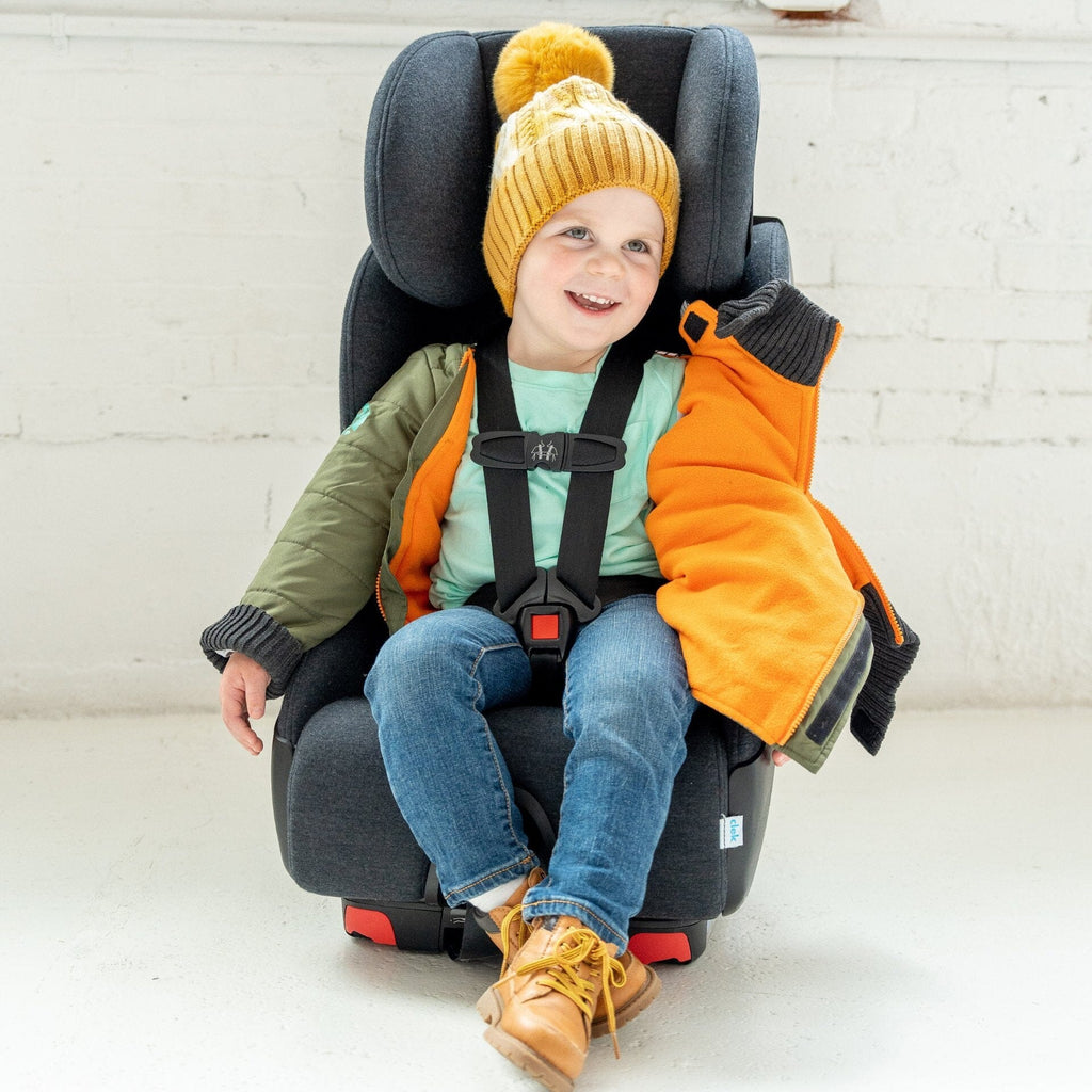 car seat coat puffy regular coat alternative in green exterior with blue interior little boy is wearing a yellow hat